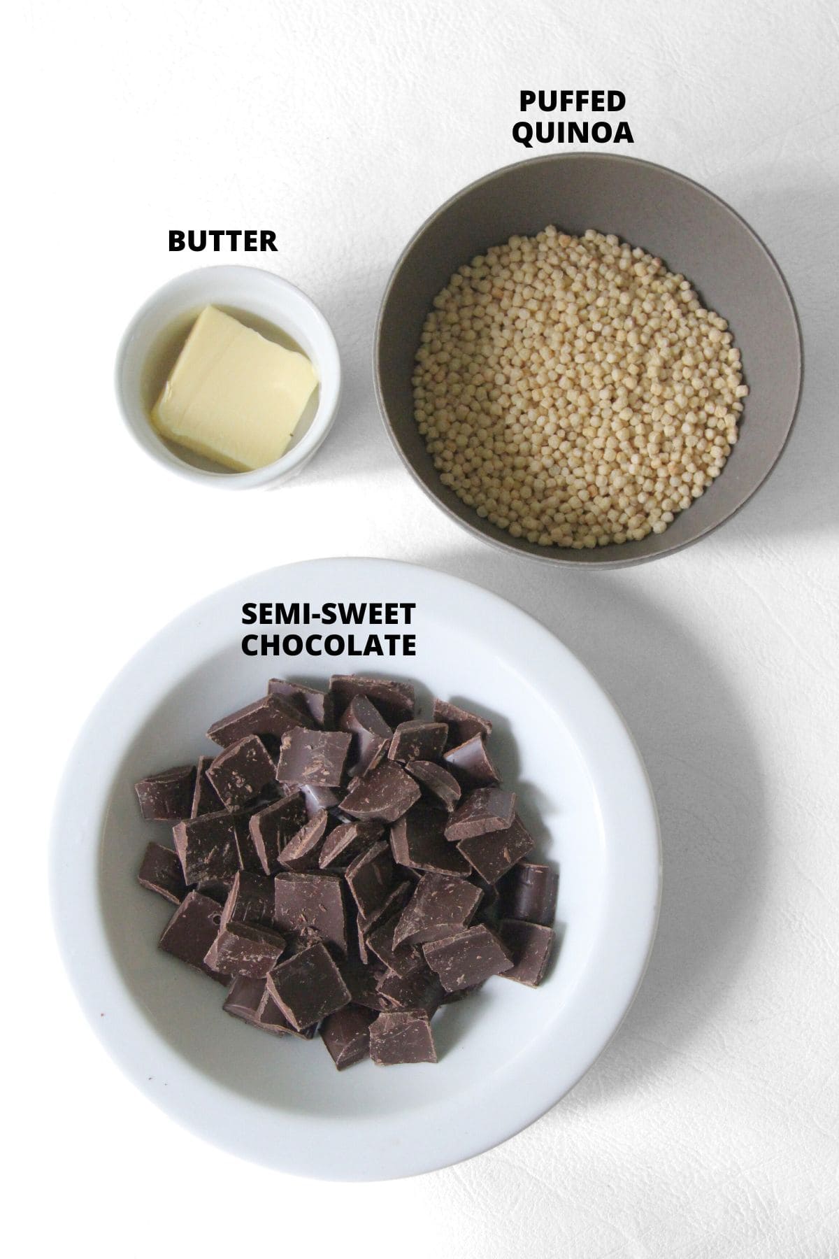 Ingredients for chocolate quinoa crisps laid out on white board.