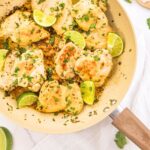 Top down view of cilantro lime chicken thighs in skillet