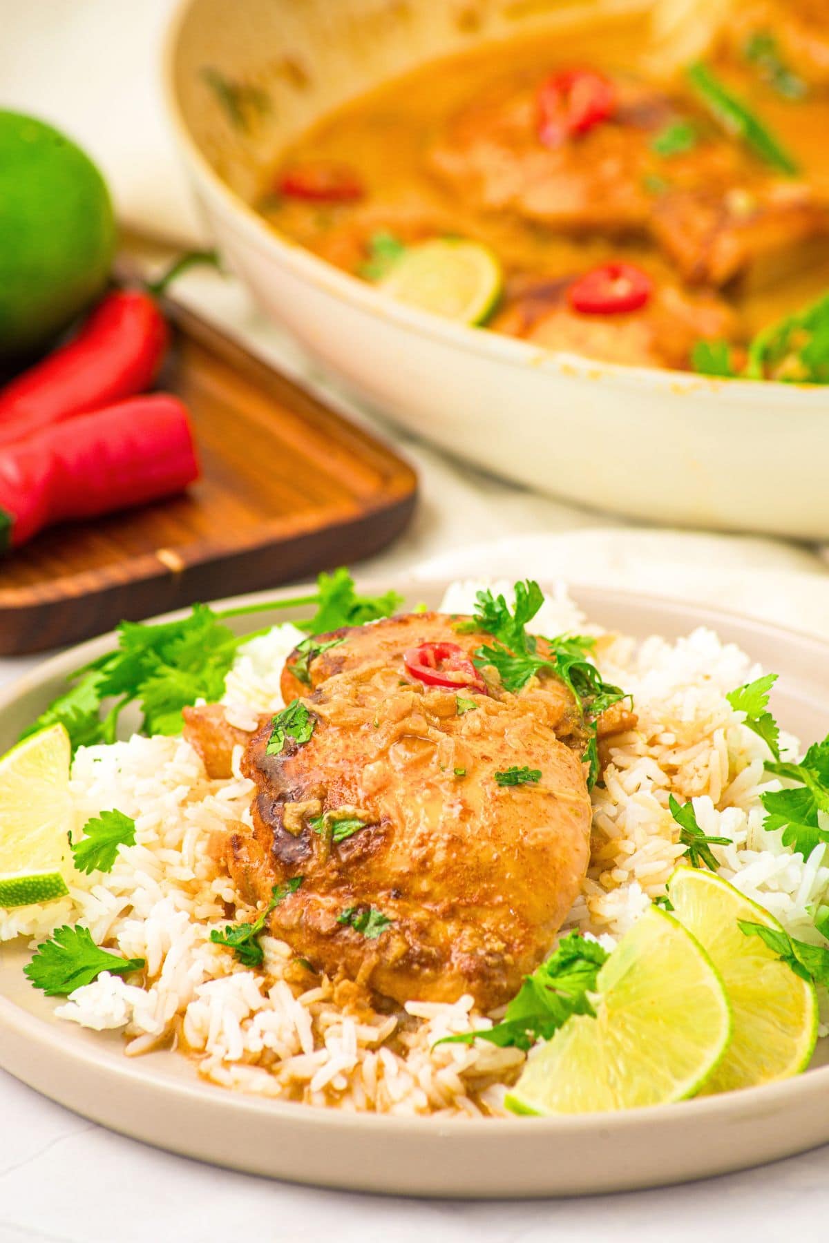 Coconut and Lime Chicken (Gluten-Free, Dairy-Free) a plate of coconut and lime chicken thighs on white rice.