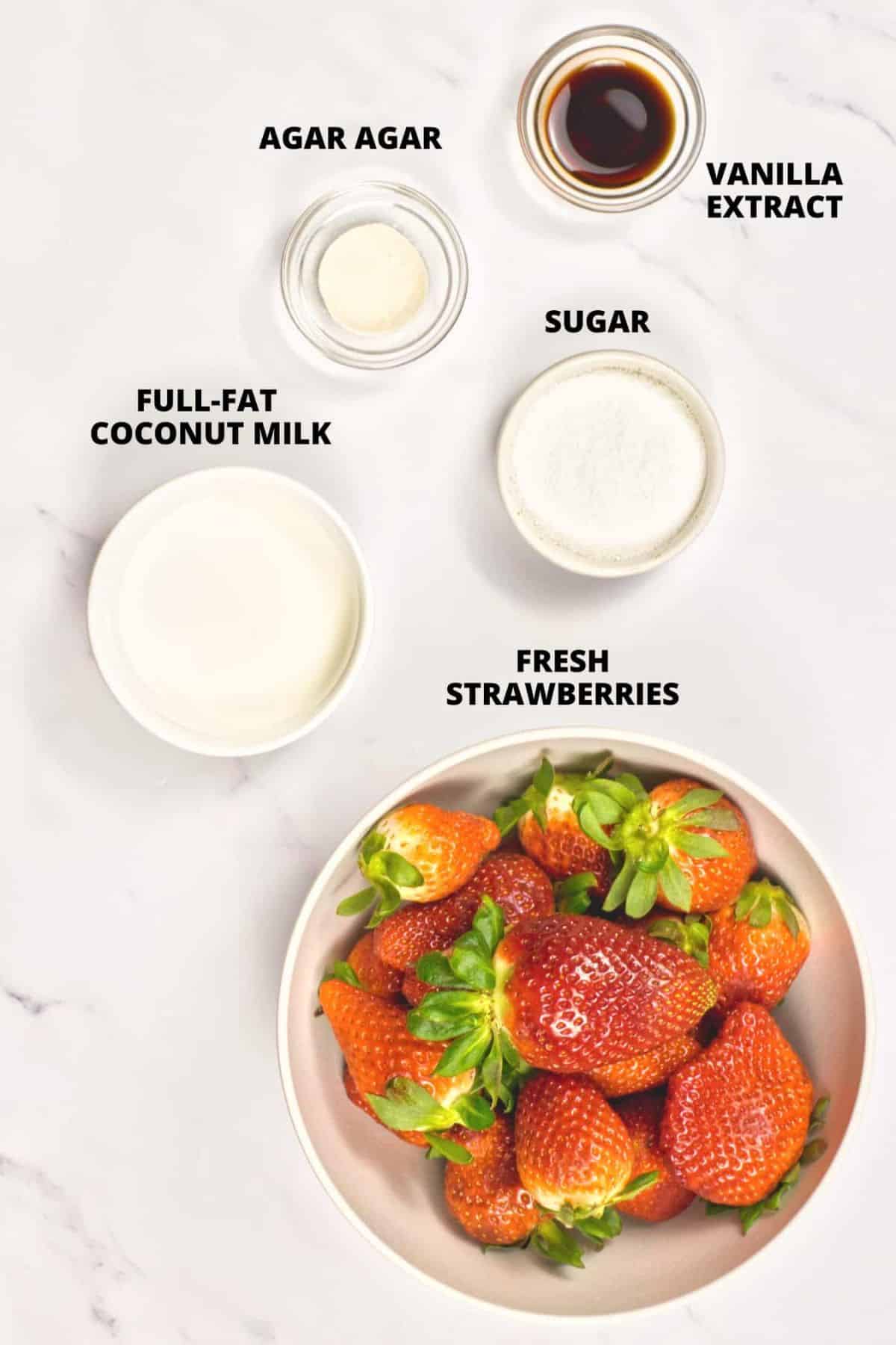 Ingredients for coconut panna cotta recipe laid out on marble board.