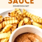 A plate full of fries and a bowl of Raising Cane's dipping sauce.