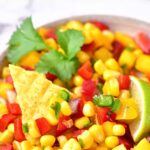 A big bowl of corn and mango salsa