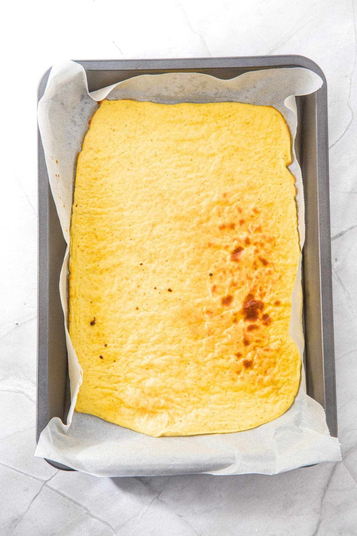 Freshly baked cottage cheese egg flatbread in pan