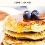 A stack of pancakes with cottage cheese topped with blueberries