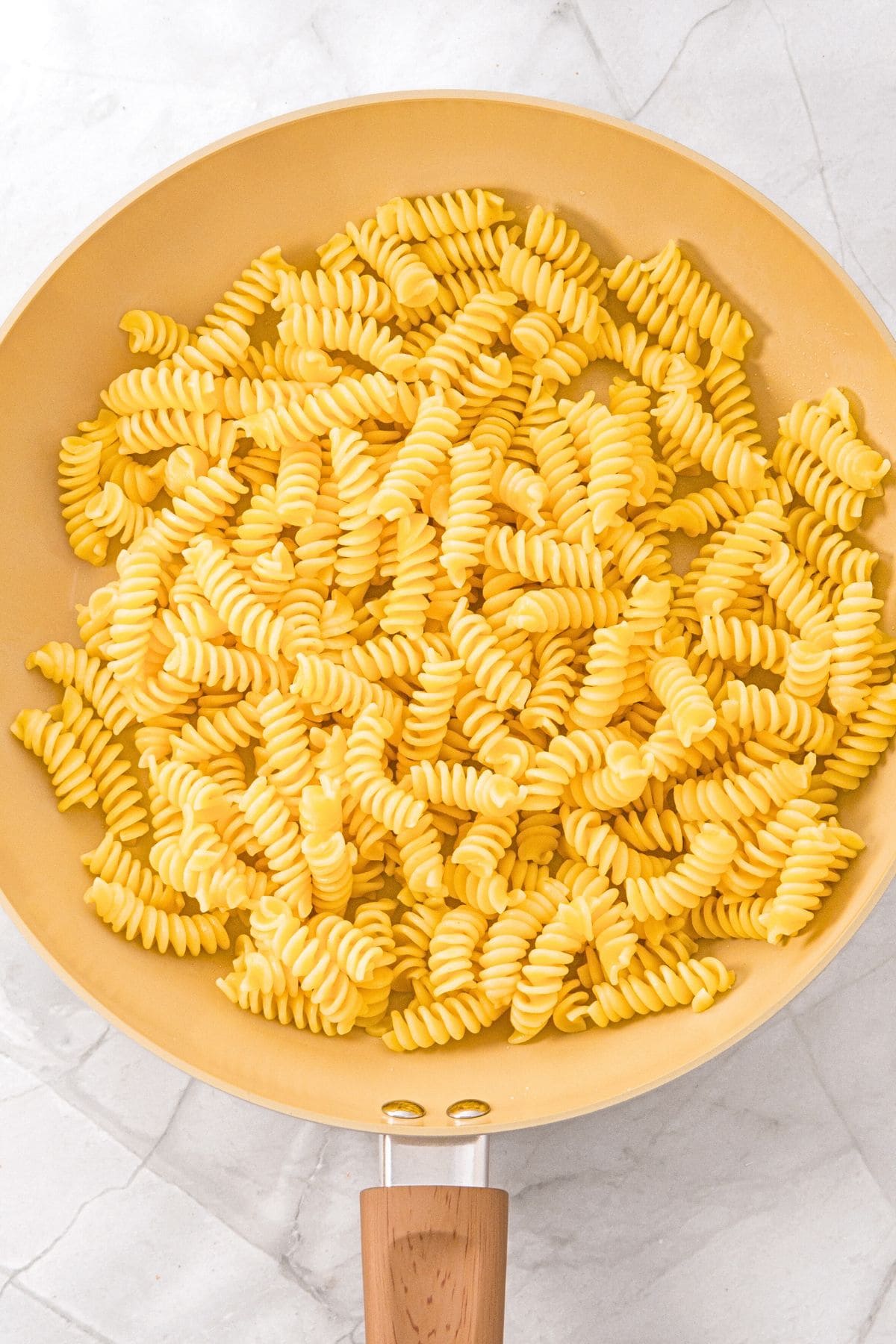 A skillet with fusilli pasta