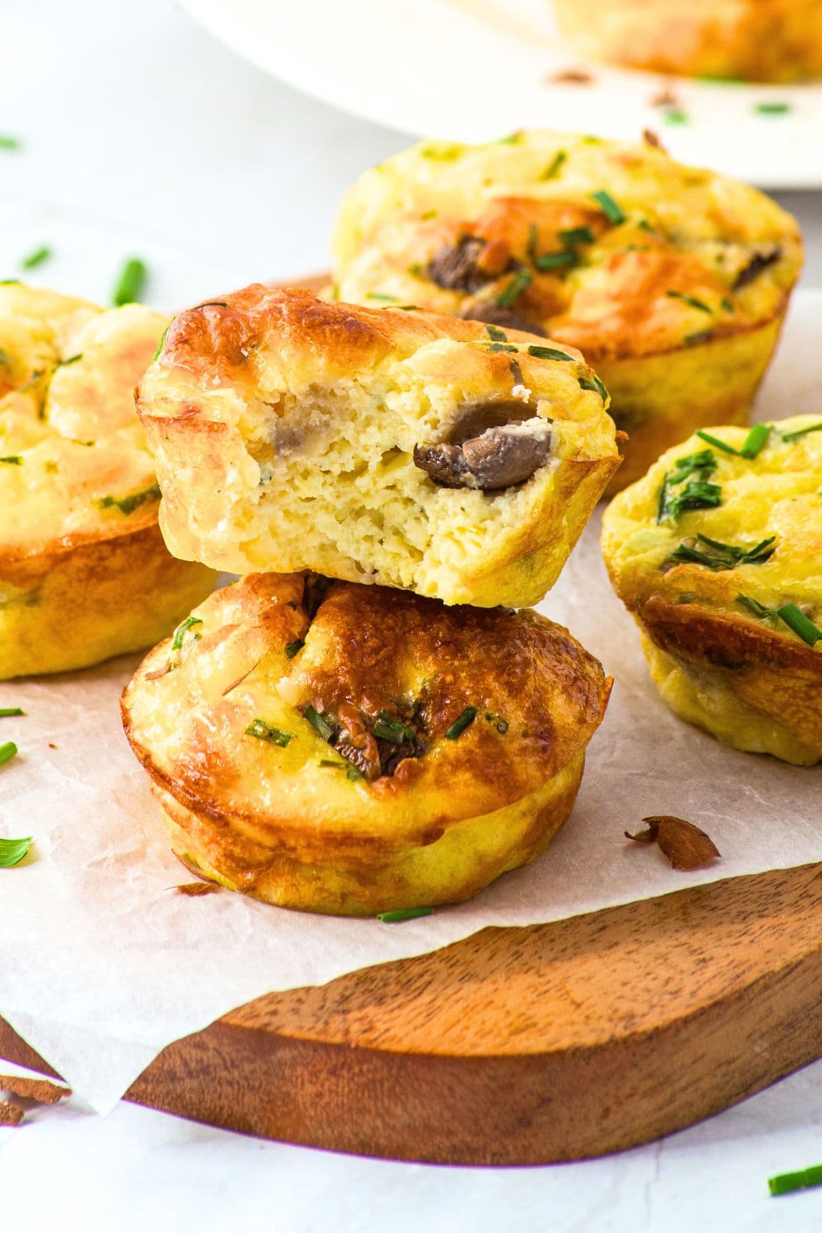 Up close view of half-eaten cottage cheese and egg muffins.