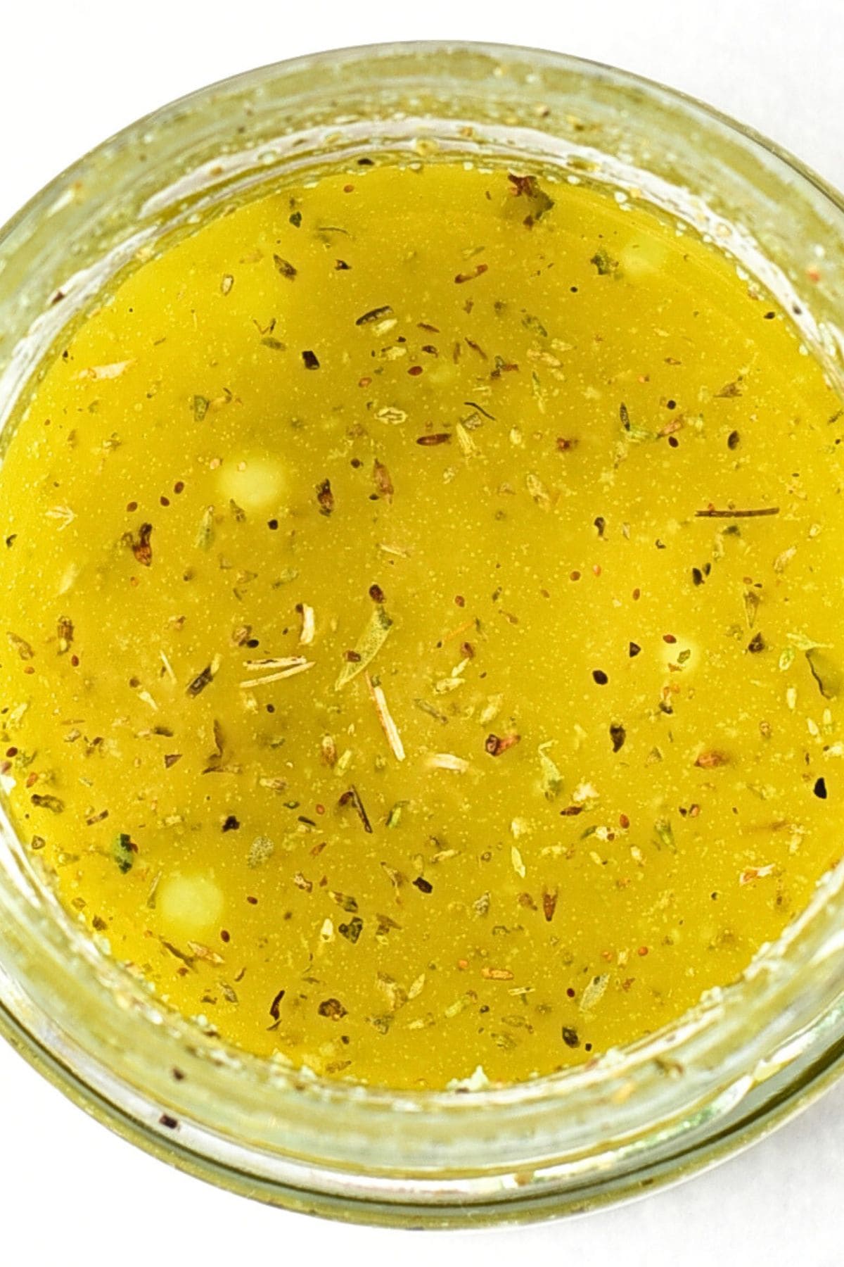 Up close view of a bowl of vinaigrette.