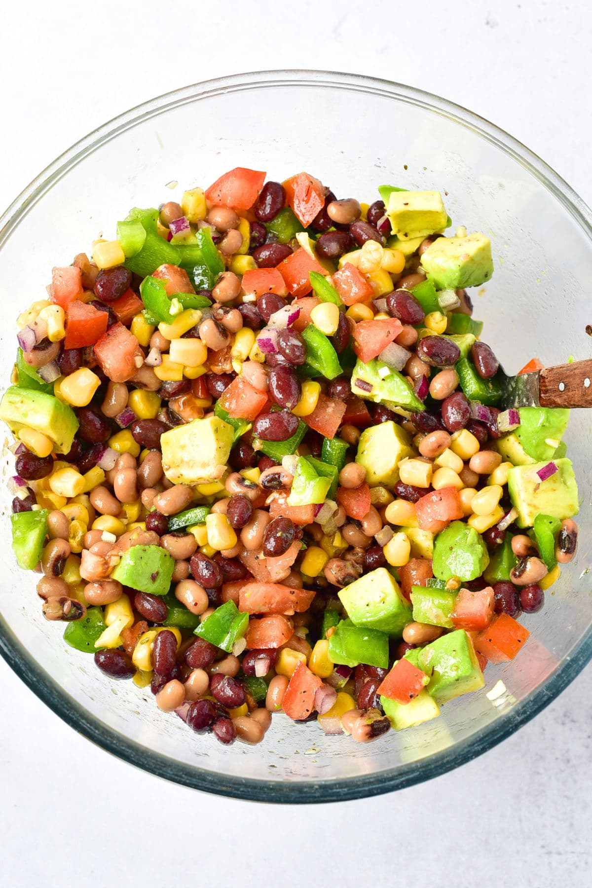 A spoon in a bowl of cowboy caviar 