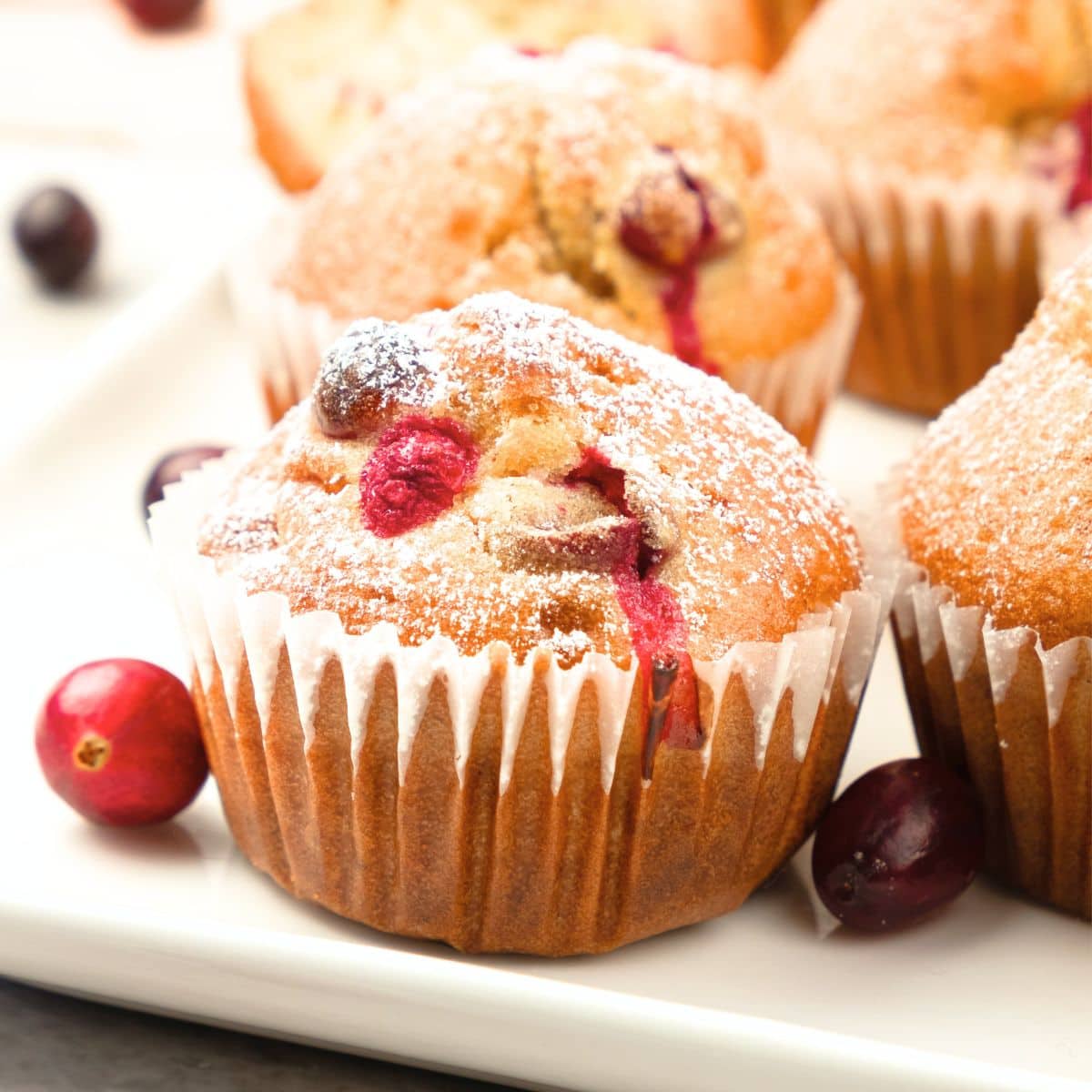 Up close shot of cranberry orange muffins on plate