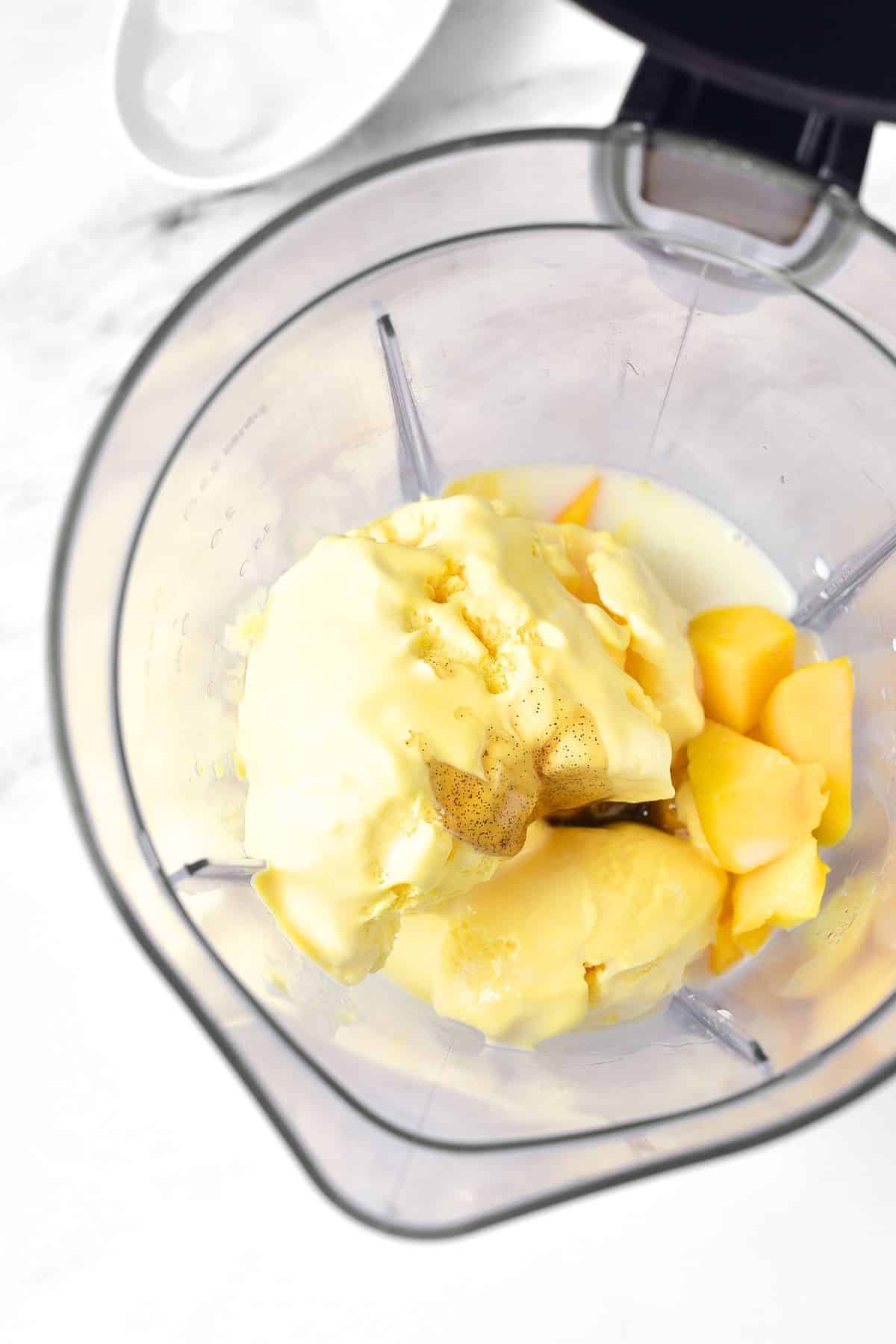 Ice cream, diced mango, milk, vanilla extract in blender.