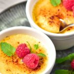 bowls of creme brulee topped with raspberries and mint
