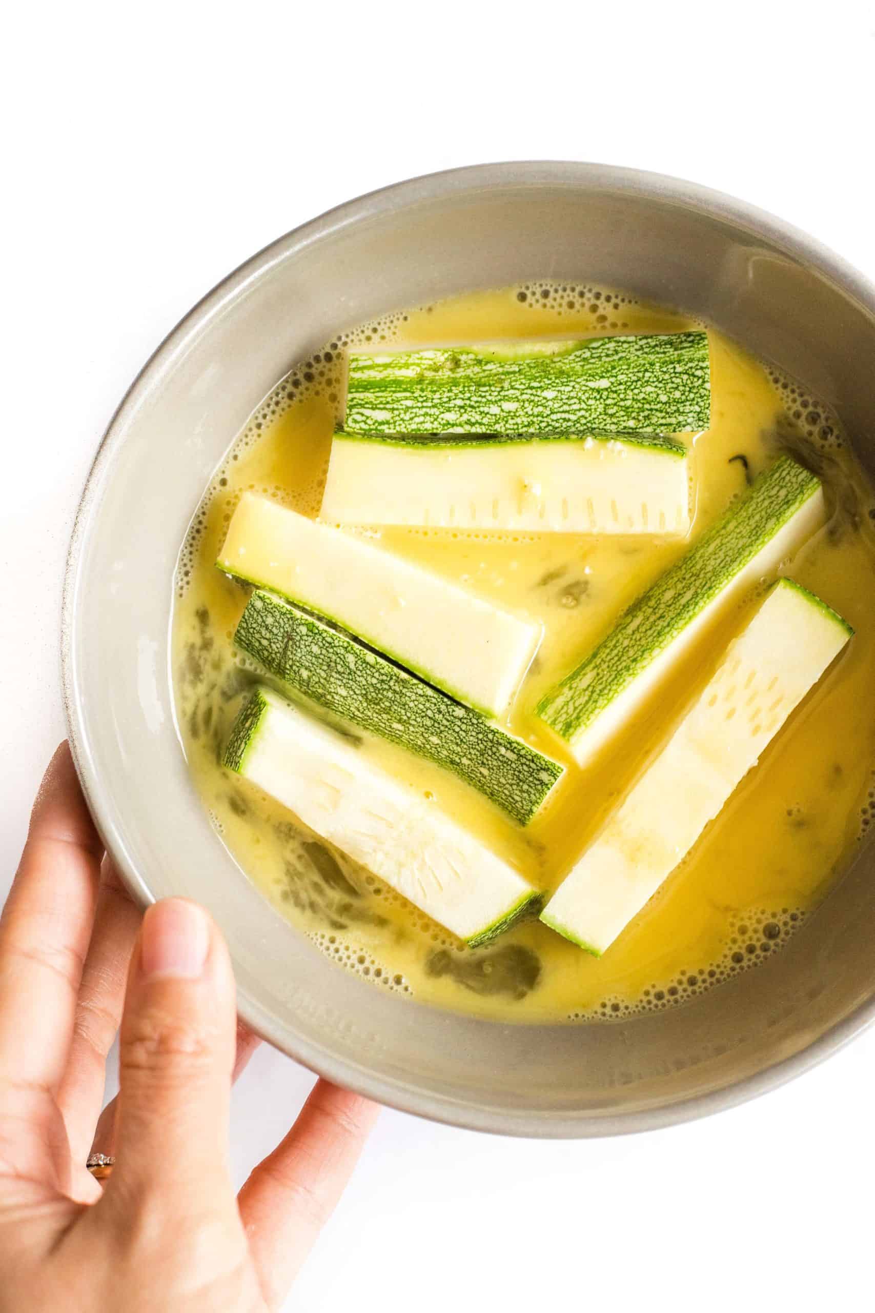 Zucchini sticks dipped in beaten egg mixture.