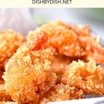 Coconut shrimp in a wire basket.