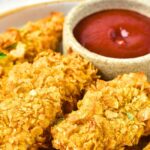 Up close view of cornflake crusted chicken strips