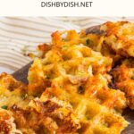 Hashbrown waffles on wooden board.