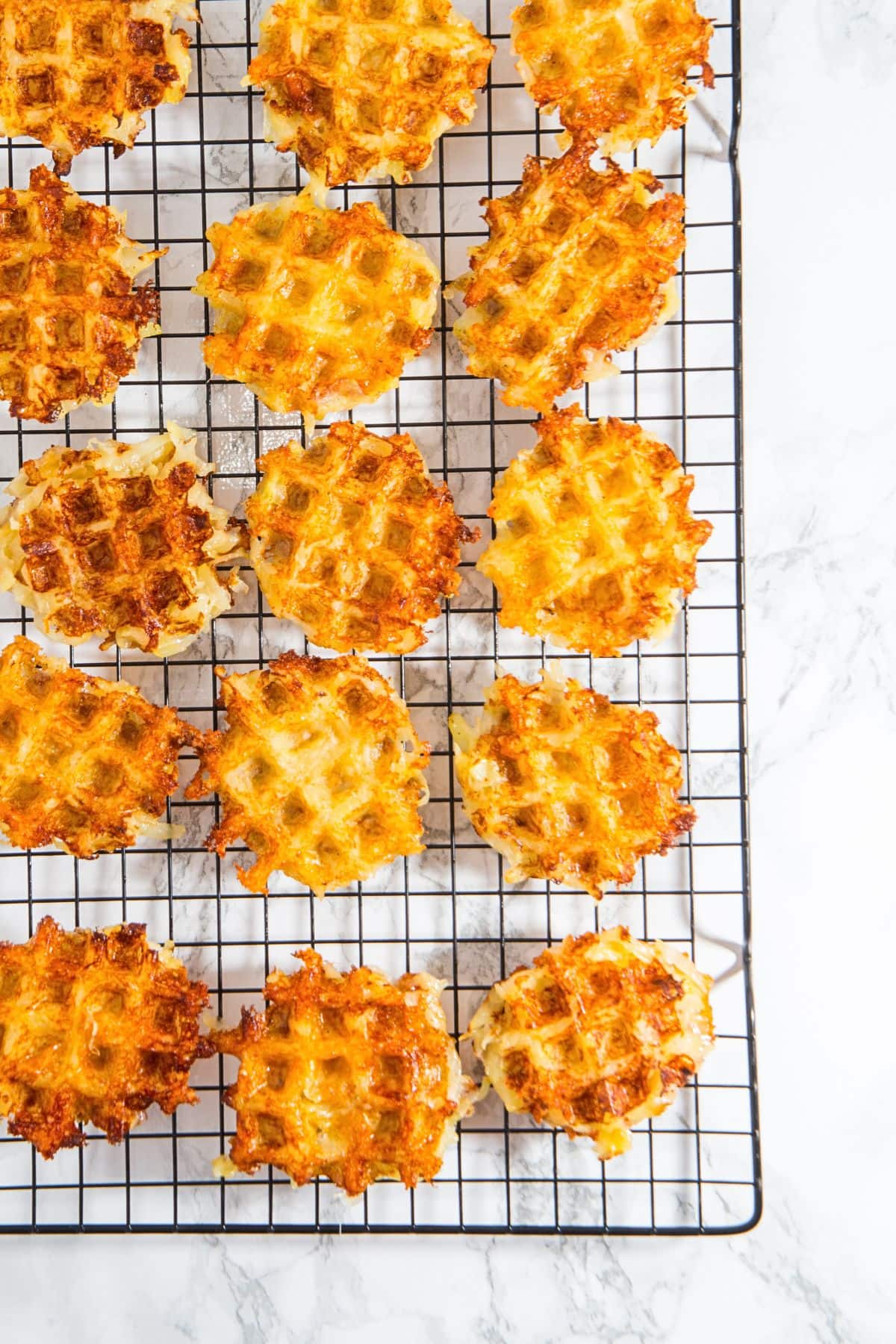 Mini hash brown waffles cooling on wire rack