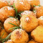 Up close view of crispy mashed potato balls.