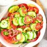 Top down view of bowl of cucumber pepper salad