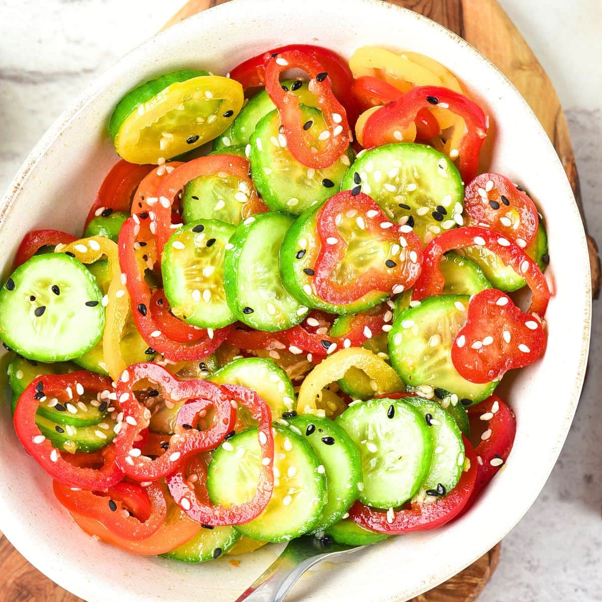 Top down view of bowl of cucumber pepper salad