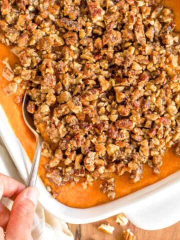 Scooping into a dairy-free sweet potato casserole