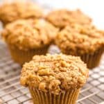 Applesauce muffins on wire rack.