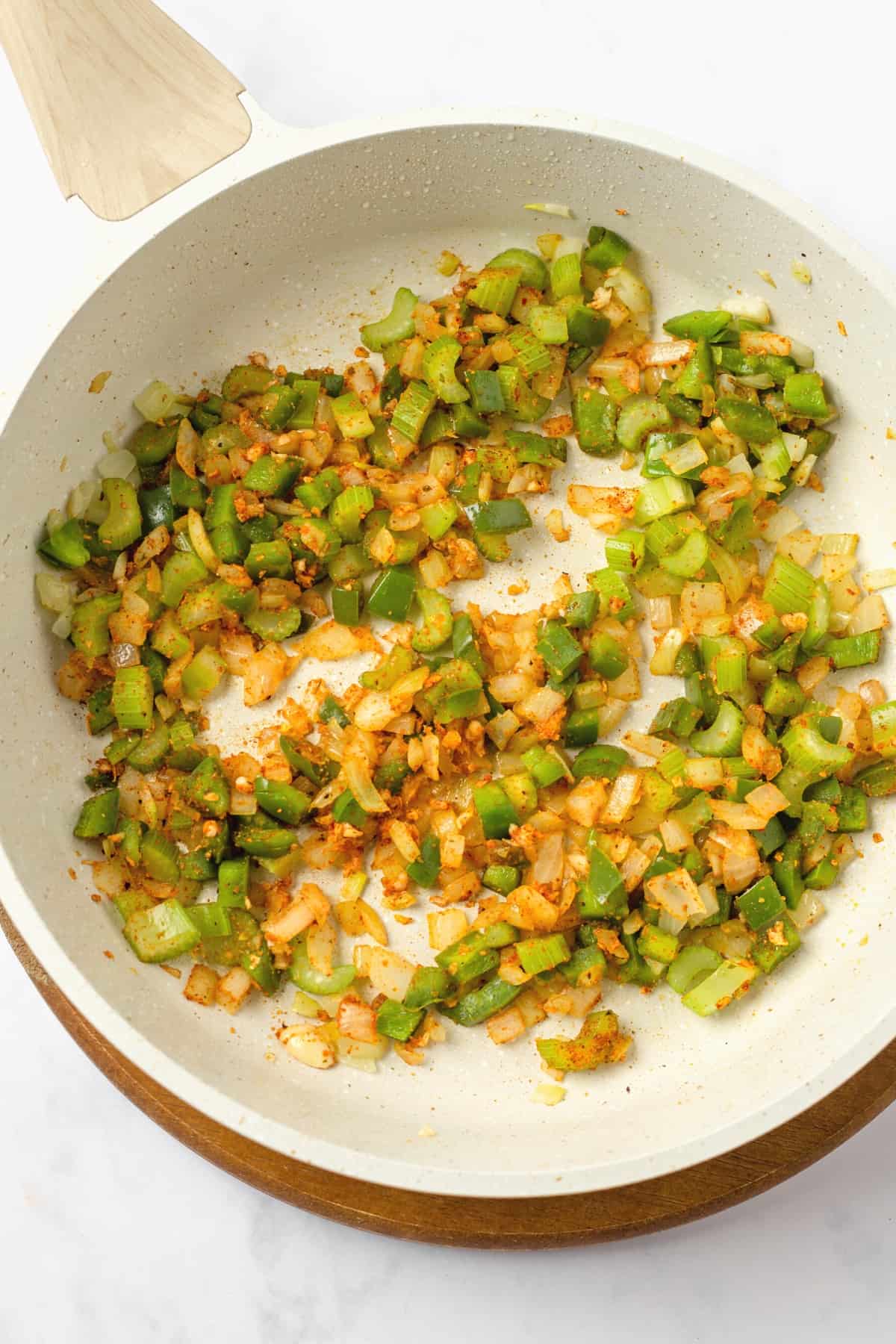 Sautéed veggies in a skillet.