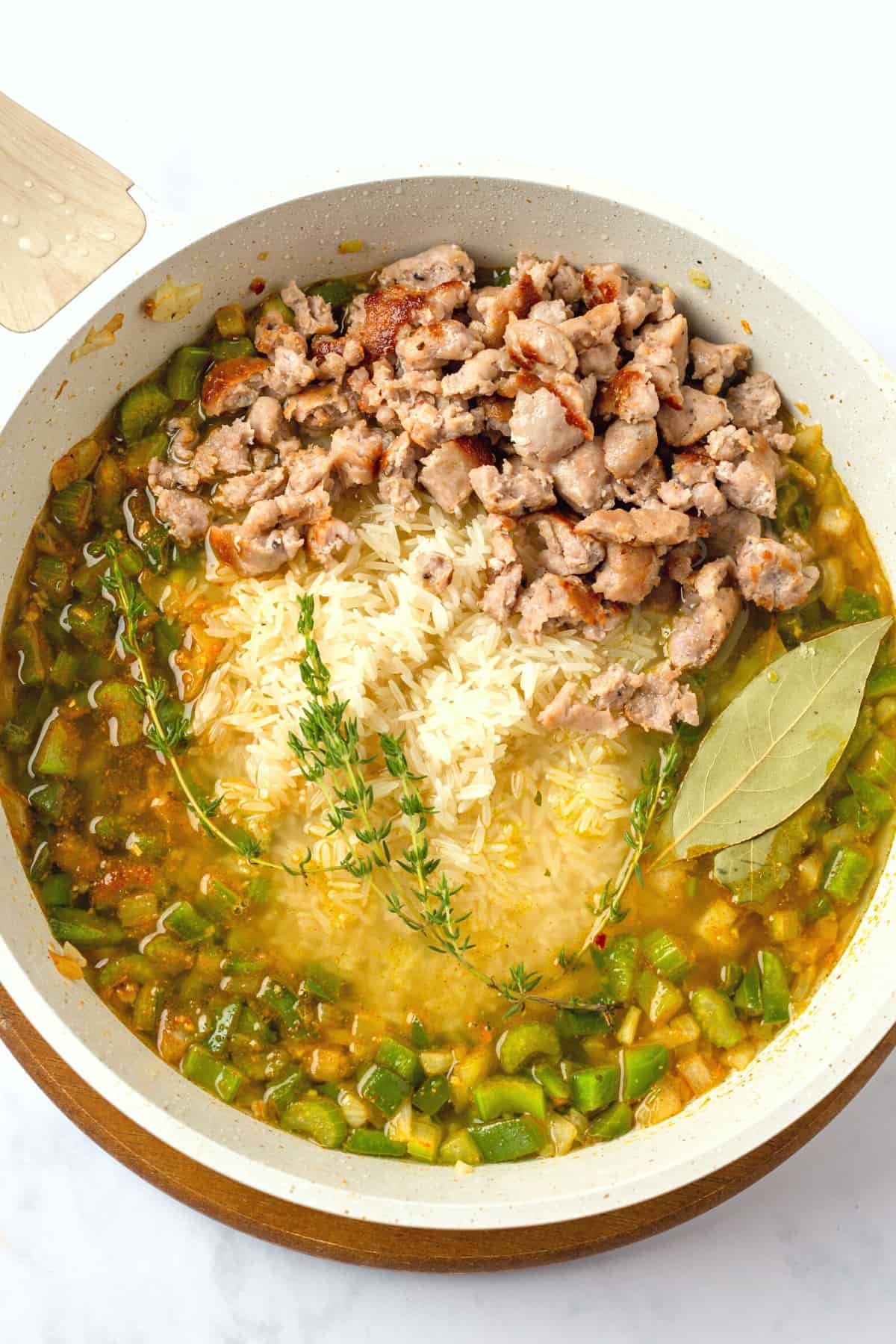 Cooking ingredients for cajun sausage rice.