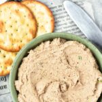 Crackers and pate on newspaper