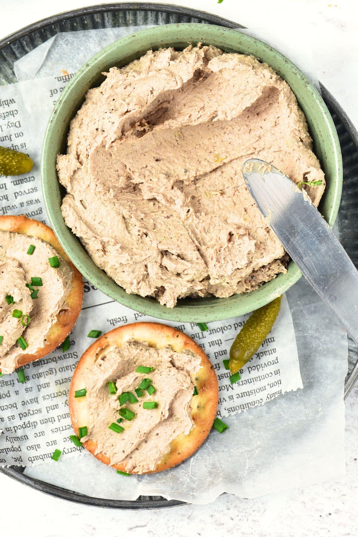 A bowl of homemade liver pate and crackers