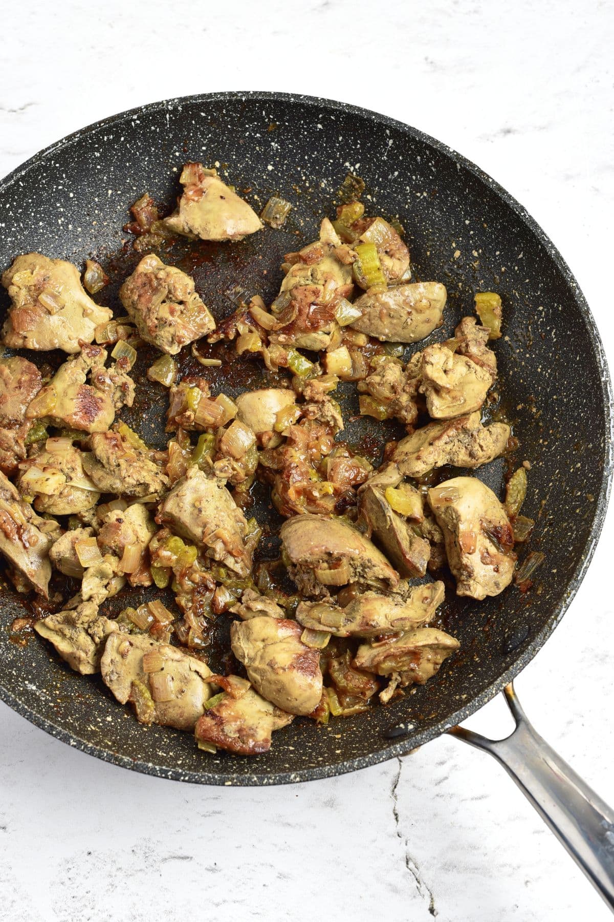 Cooked liver and veggies in skillet