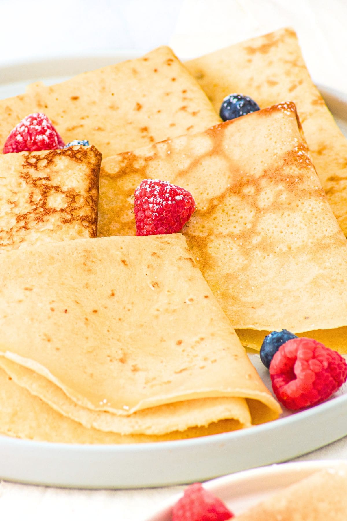 A plate of folded homemade almond flour crepes