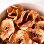 Top down view of a bowl of crispy apple chips