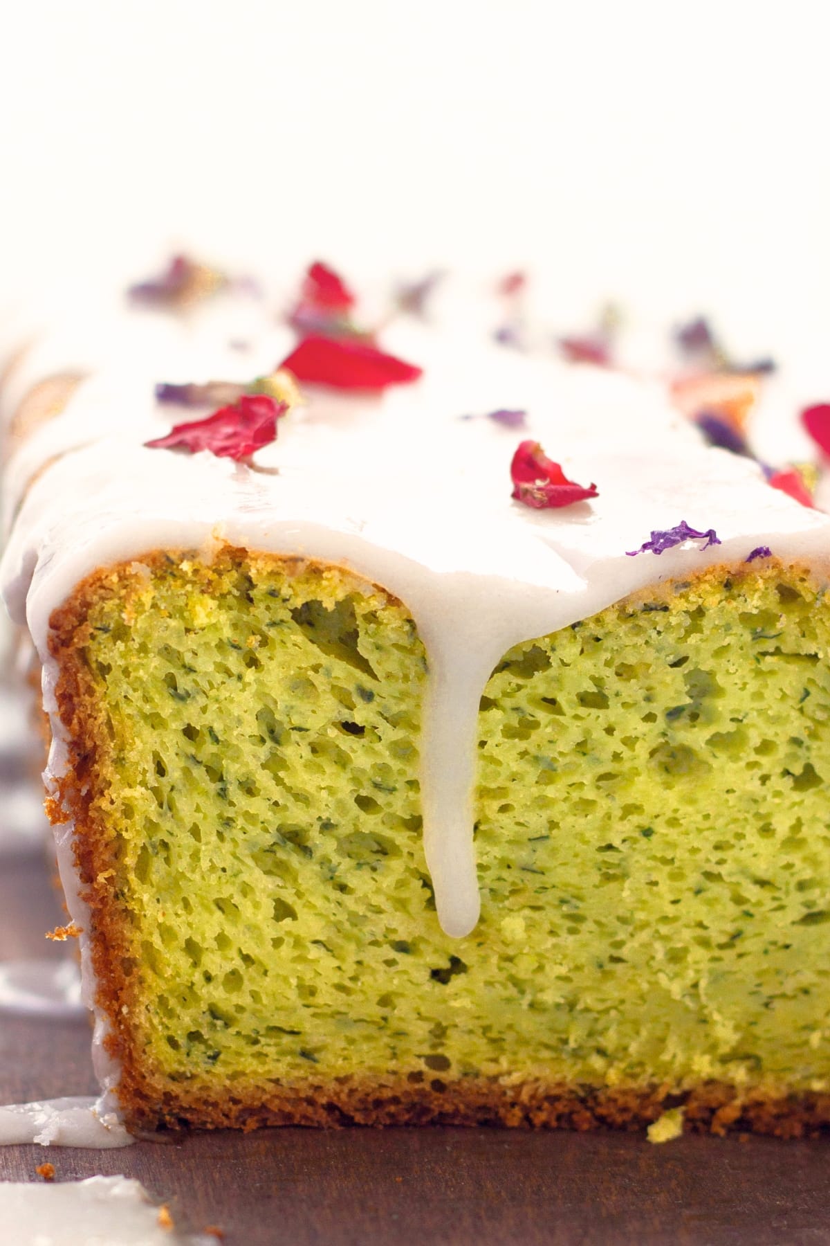 Vegan Avocado Cake (Gluten-Free) Up close shot of vegan avocado cake with lemon glaze