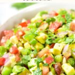 Up close view of a bowl of chunky avocado salsa