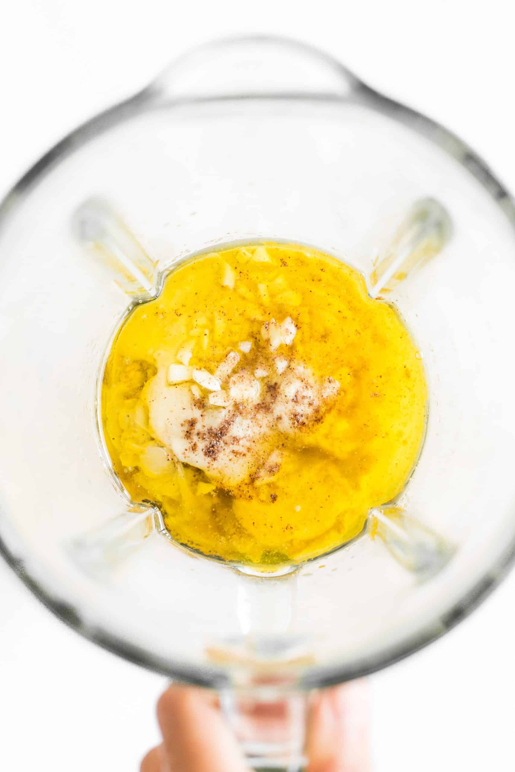 Ingredients in the bowl of a blender.