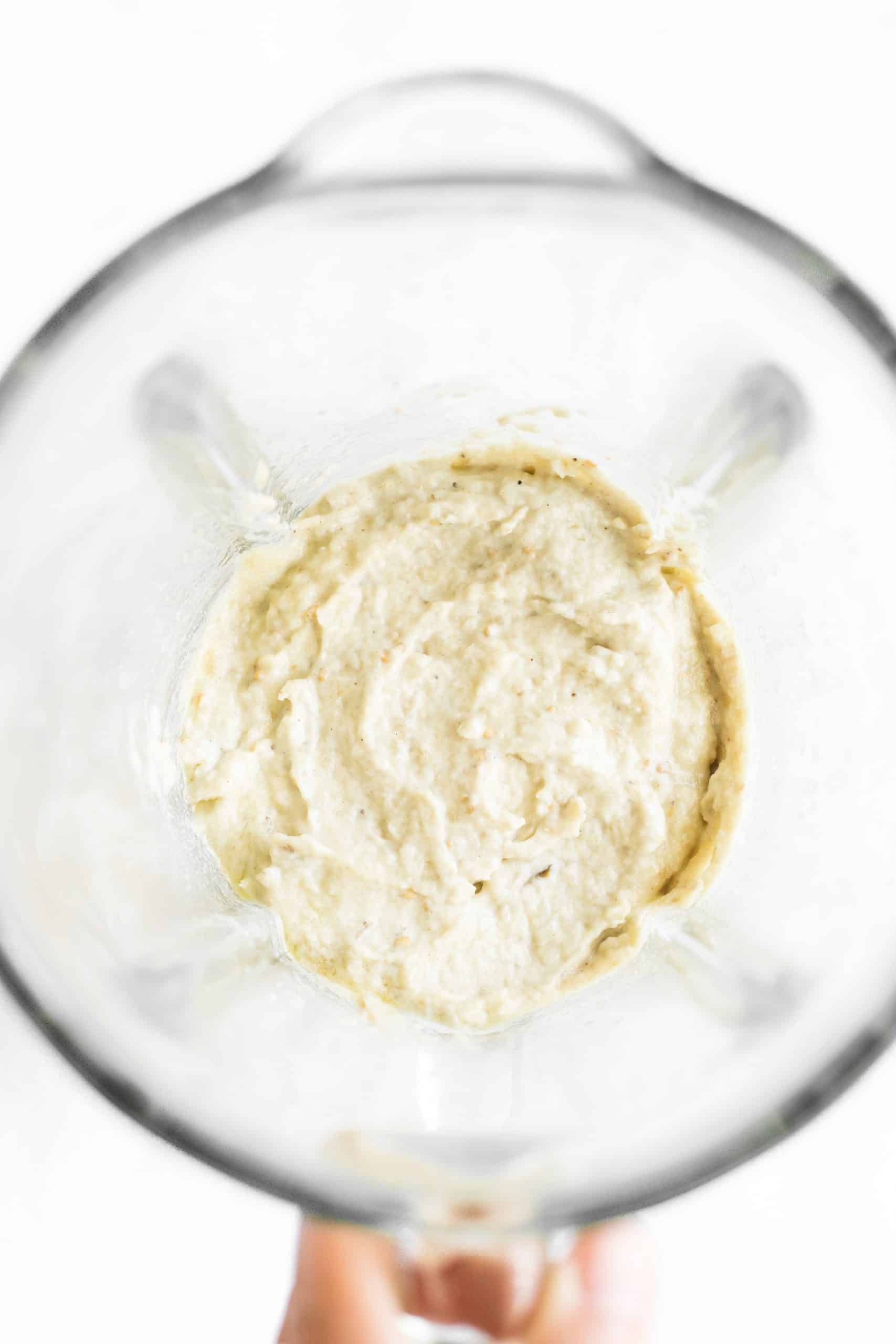 Processed dip in the bowl of a blender.