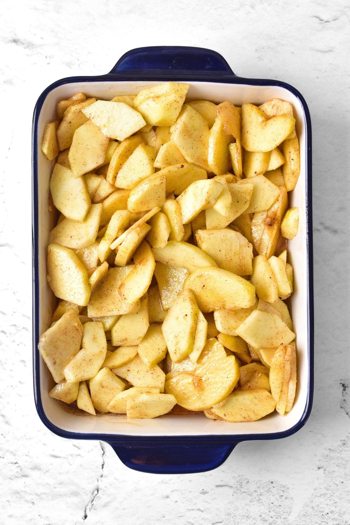 Sliced apples tossed with cinnamon