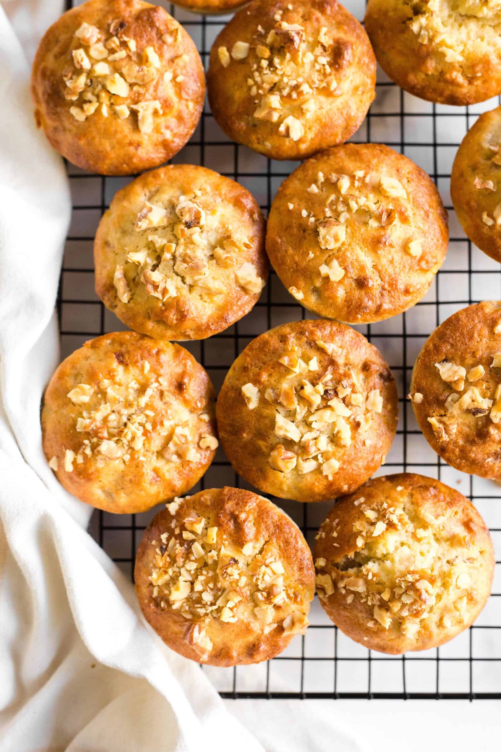 Gluten-free dairy-free banana nut muffins cooling on a wire rack.