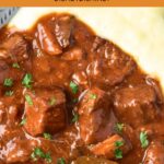 Top down view of mashed potatoes and beef stew.