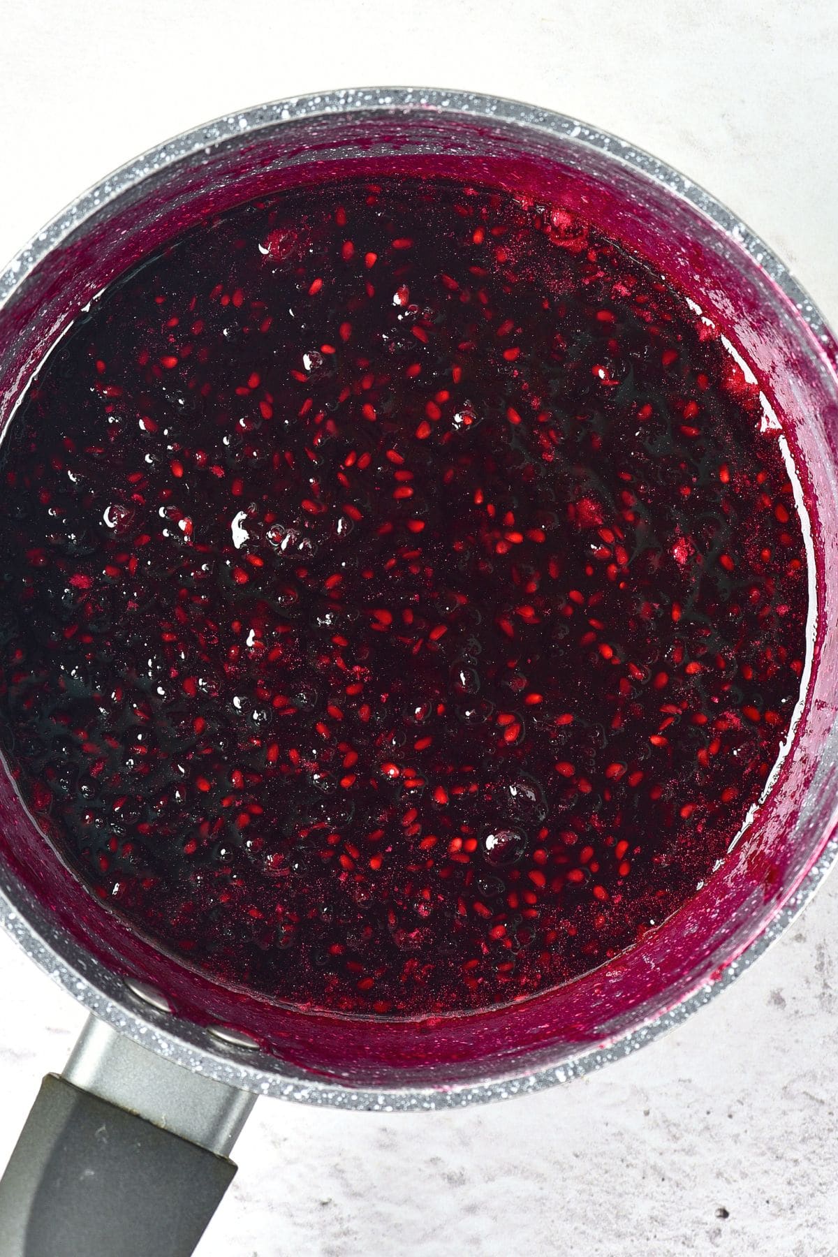Blackberry jam cooking in saucepan