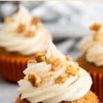 Three carrot cupcakes on board.