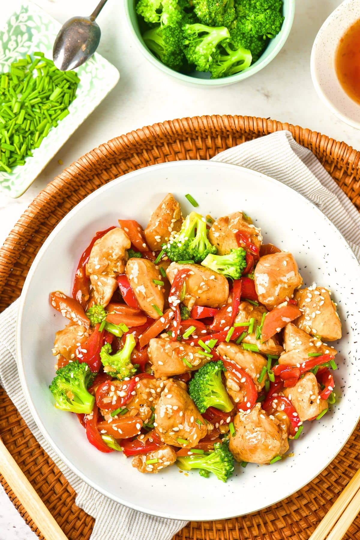 Top down view of a plate of chicken stir fry in tray.