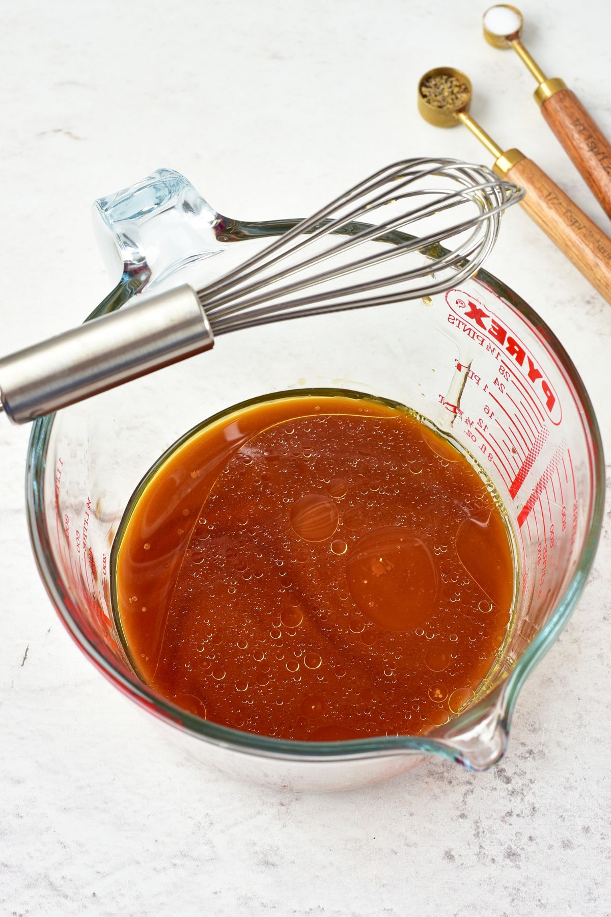 Brown sauce in a measuring bowl