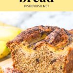 Half-sliced loaf of banana bread with chocolate chips