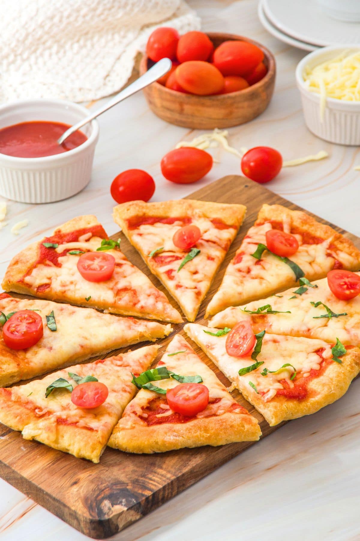 Sliced pizza on wooden board