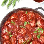 A skillet of cranberry meatballs