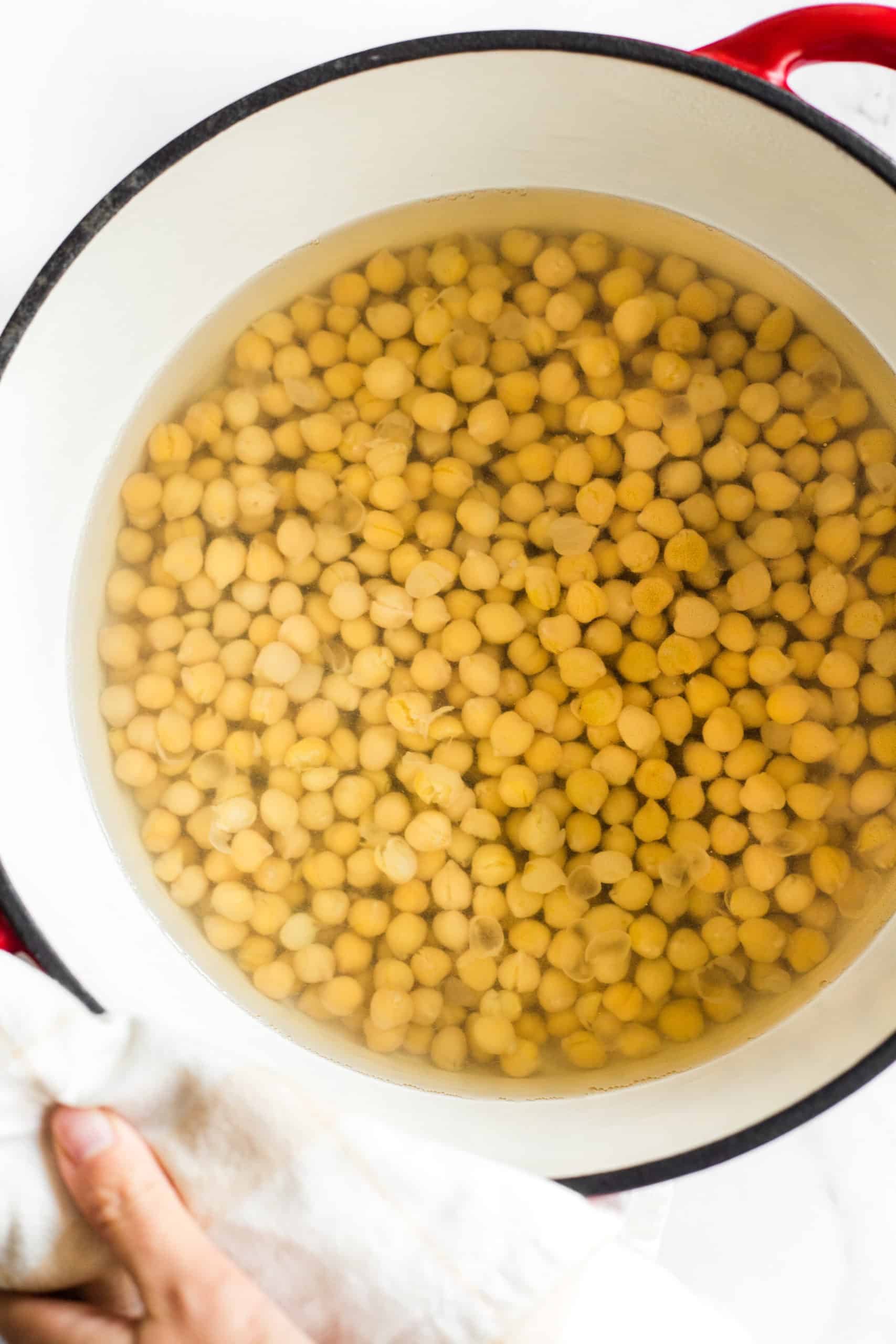 Chickpeas simmering in a large pot.