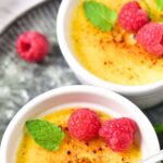 Spoon digging into bowl of creme brulee