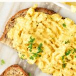 Top down view of slices of bread with curried egg salad