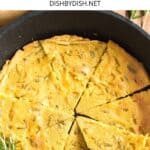 Hand reaching for a slice of farinata.